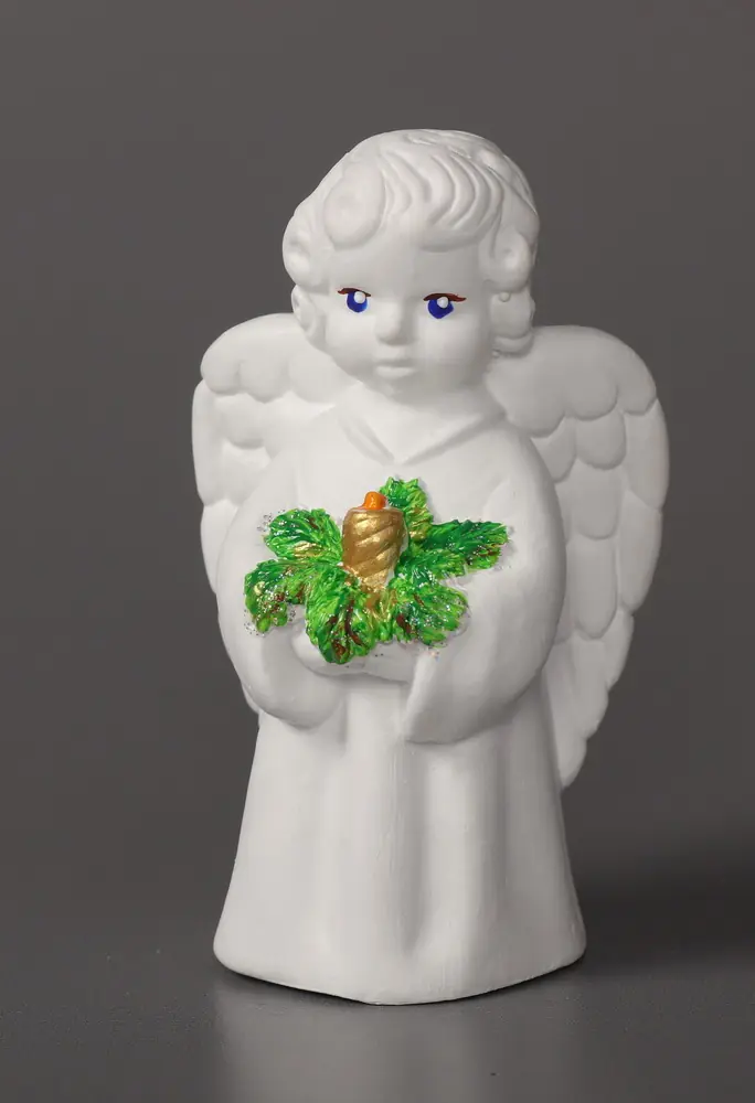 Guardian Angel plaster sculpture with Christmas with candle